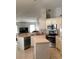 Modern kitchen with an island, stainless steel appliances and an open concept layout at 2717 Bayview Dr, Eustis, FL 32726