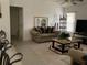 Comfortable living room featuring stylish sofa, decorative pillows, and a modern entertainment center at 2717 Bayview Dr, Eustis, FL 32726