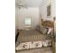 Comfortable bedroom showcasing a large bed, ensuite access, and ceiling fan at 2717 Bayview Dr, Eustis, FL 32726
