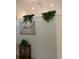 Beautiful decor features a faith-themed painting and lush greenery adorning the walls at 2717 Bayview Dr, Eustis, FL 32726