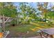 Large backyard with garden, picnic table, and lush greenery at 1788 N Hiawassee Rd, Orlando, FL 32818