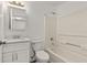 Bathroom featuring a shower-tub combo with modern white fixtures, a toilet, and a sink at 3651 N Goldenrod Rd # 204, Winter Park, FL 32792