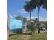 Exterior view of Lancelot Condominiums sign near the building and parking at 3651 N Goldenrod Rd # 204, Winter Park, FL 32792