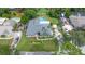 Birds eye view of home, with rectangular pool, green lawn, and driveway at 685 Chelsea Rd, Longwood, FL 32750