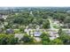 Expansive aerial view of a property featuring a sparkling blue pool, mature trees, and a well-maintained yard at 685 Chelsea Rd, Longwood, FL 32750