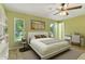 Serene bedroom with natural light, comfortable furnishings, and calming green walls creating a relaxing retreat at 685 Chelsea Rd, Longwood, FL 32750