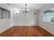 Traditional dining room with wood floors, chandelier lighting, and ample space for entertaining at 685 Chelsea Rd, Longwood, FL 32750