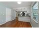 Open concept kitchen and dining area with stainless steel appliances, granite countertops, and white cabinets at 685 Chelsea Rd, Longwood, FL 32750