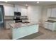 A spacious kitchen featuring granite countertops, stainless steel appliances, and ample white cabinetry at 1552 Lakeside Dr, Deland, FL 32720