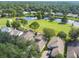 Overhead view of homes by a pond and golf course at 1730 Stafford Springs Blvd, Mount Dora, FL 32757