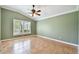 Spacious bedroom with neutral walls, ceramic tile floor, and a shuttered window at 1730 Stafford Springs Blvd, Mount Dora, FL 32757