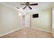 Bedroom featuring a ceiling fan, television and ceramic tile floors at 1730 Stafford Springs Blvd, Mount Dora, FL 32757