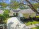 Inviting single Gathering home with well-maintained landscaping and long driveway at 1730 Stafford Springs Blvd, Mount Dora, FL 32757