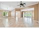 Open concept living room with tile flooring, chandelier, and access to porch at 1730 Stafford Springs Blvd, Mount Dora, FL 32757