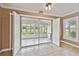 Spacious sunroom with tile floors, offering an airy space filled with natural light at 1730 Stafford Springs Blvd, Mount Dora, FL 32757