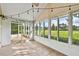 Relaxing sunroom features tile floors, bright windows, and access to an outdoor patio at 1730 Stafford Springs Blvd, Mount Dora, FL 32757