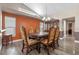 Formal dining room with a wood table and ornate chairs at 1451 Twin Rivers Blvd, Oviedo, FL 32766