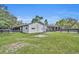 White barn exterior with additional storage and fenced pastures at 2075 Genova Dr, Oviedo, FL 32765