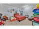 Cozy bedroom with a full-size bed and plenty of space for children at 2075 Genova Dr, Oviedo, FL 32765