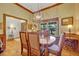 Elegant dining room with wood floors and large window at 2075 Genova Dr, Oviedo, FL 32765