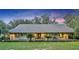 House exterior at dusk showcasing a large front porch at 2075 Genova Dr, Oviedo, FL 32765