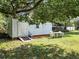 Backyard with shed, ramp access, and patio table at 290 Valencia Rd, Debary, FL 32713