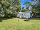 Backyard oasis with shed, fire pit, and seating area at 290 Valencia Rd, Debary, FL 32713