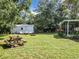 Large backyard with shed and picnic table at 290 Valencia Rd, Debary, FL 32713