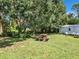 Large backyard with picnic table and mature trees at 290 Valencia Rd, Debary, FL 32713