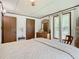 Bedroom with dresser and window at 290 Valencia Rd, Debary, FL 32713