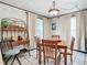 Charming dining area featuring a wooden table and built-in hutch at 290 Valencia Rd, Debary, FL 32713