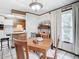 Bright dining room with a wooden table and chairs at 290 Valencia Rd, Debary, FL 32713