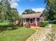 Charming ranch home with stone exterior and lush landscaping at 290 Valencia Rd, Debary, FL 32713