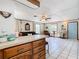 Bright kitchen features wood cabinets and a breakfast bar at 290 Valencia Rd, Debary, FL 32713