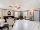 Living room with tile floors, comfortable seating, and large windows at 290 Valencia Rd, Debary, FL 32713