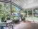 Relaxing screened porch with outdoor seating at 290 Valencia Rd, Debary, FL 32713