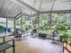 Relaxing screened porch with outdoor seating and lush greenery at 290 Valencia Rd, Debary, FL 32713