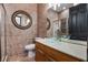 Bathroom with vessel sink, granite counters, framed mirror and shower at 349 La Creek Ct, Debary, FL 32713