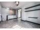 Bonus room featuring gray walls, tile flooring, floating shelves, and a skylight for natural light at 349 La Creek Ct, Debary, FL 32713