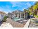 Relaxing screened-in pool with comfortable seating and beautiful landscaping provides a private outdoor oasis at 349 La Creek Ct, Debary, FL 32713