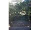 Partial view of backyard with pond and trees at 11 Escondido Cir # 105, Altamonte Springs, FL 32701