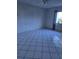Bedroom with tile floors, ceiling fan, and window at 11 Escondido Cir # 105, Altamonte Springs, FL 32701