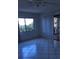 Bedroom with tile floor, large window, and patio access at 11 Escondido Cir # 105, Altamonte Springs, FL 32701