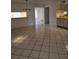 Open dining area with tile floors and kitchen view at 11 Escondido Cir # 105, Altamonte Springs, FL 32701