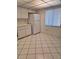 Kitchen features white cabinets and refrigerator at 11 Escondido Cir # 105, Altamonte Springs, FL 32701