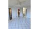 Bright living room with tile floors and access to other rooms at 11 Escondido Cir # 105, Altamonte Springs, FL 32701