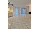 Spacious living room with tile floors and access to patio at 11 Escondido Cir # 105, Altamonte Springs, FL 32701