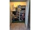Storage closet with shelving and various items at 11 Escondido Cir # 105, Altamonte Springs, FL 32701