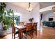 Lovely dining room with wood floors and a large window providing plenty of natural light at 337 Goldstone Pl, Lake Mary, FL 32746