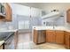 Modern kitchen with stainless steel appliances, white countertops, and seamless flow to the dining area at 337 Goldstone Pl, Lake Mary, FL 32746